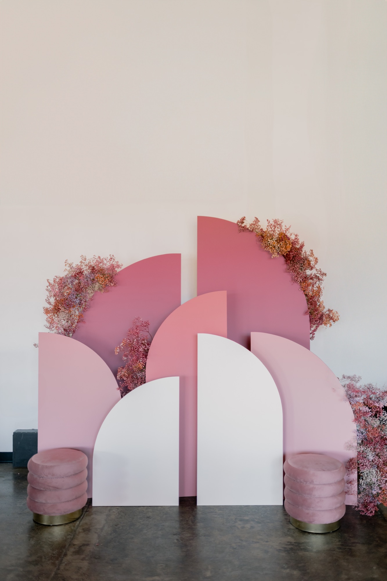 AVENTZ Co. boutique event — pink arched backdrop with dried florals, Shannon Bialy Photography