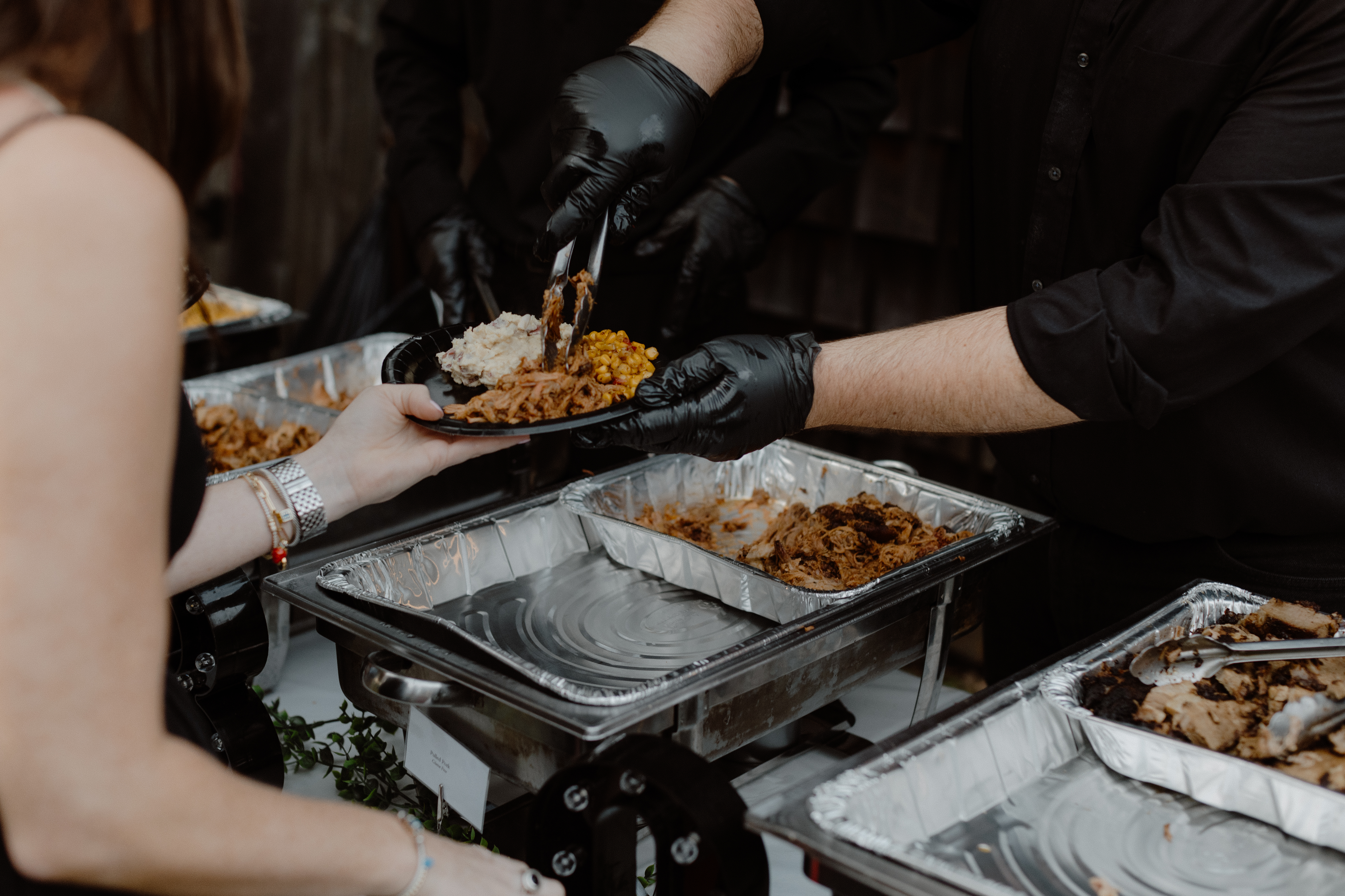 caterer serving food at wedding reception