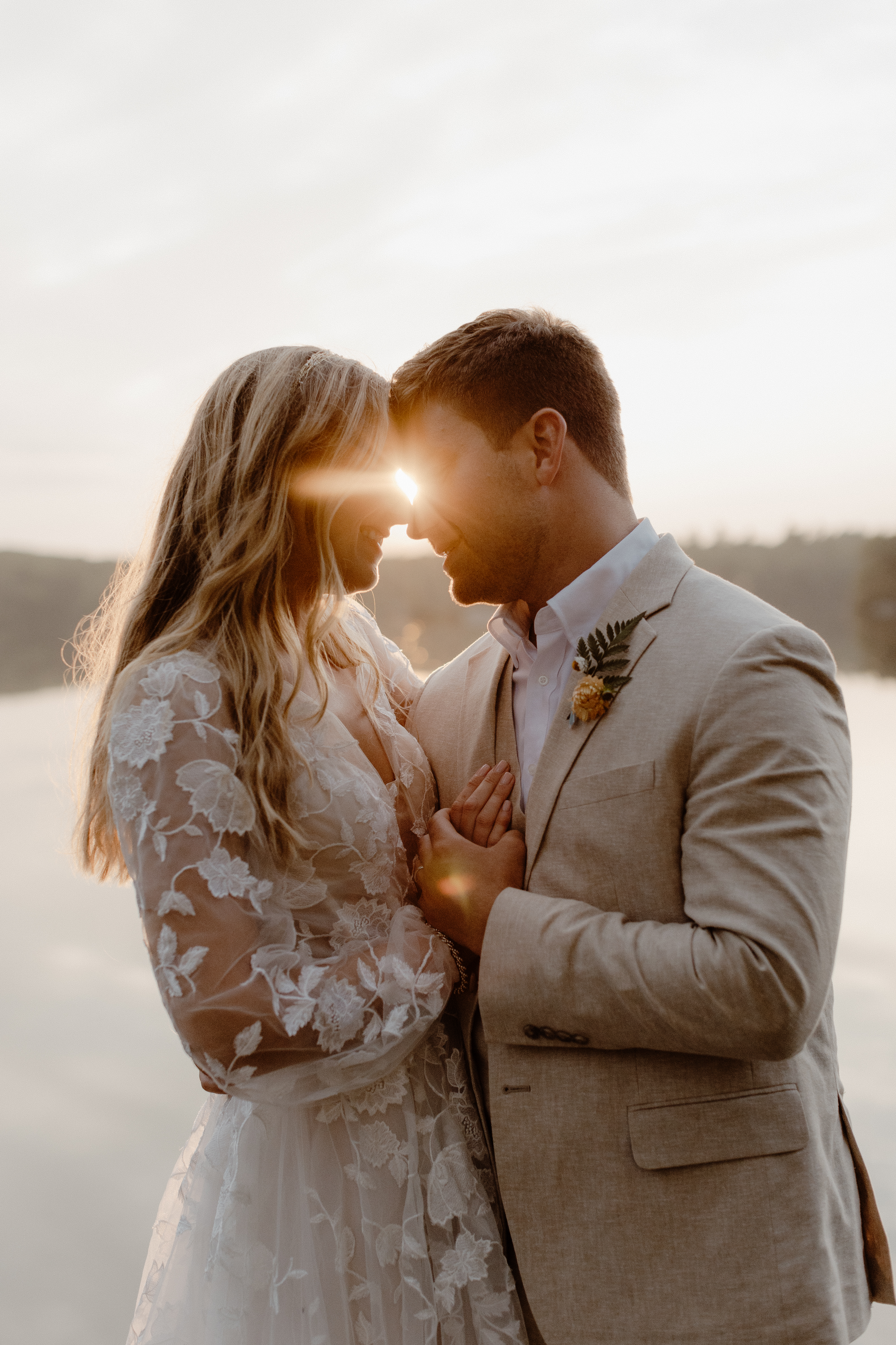 couple kissing at sunset