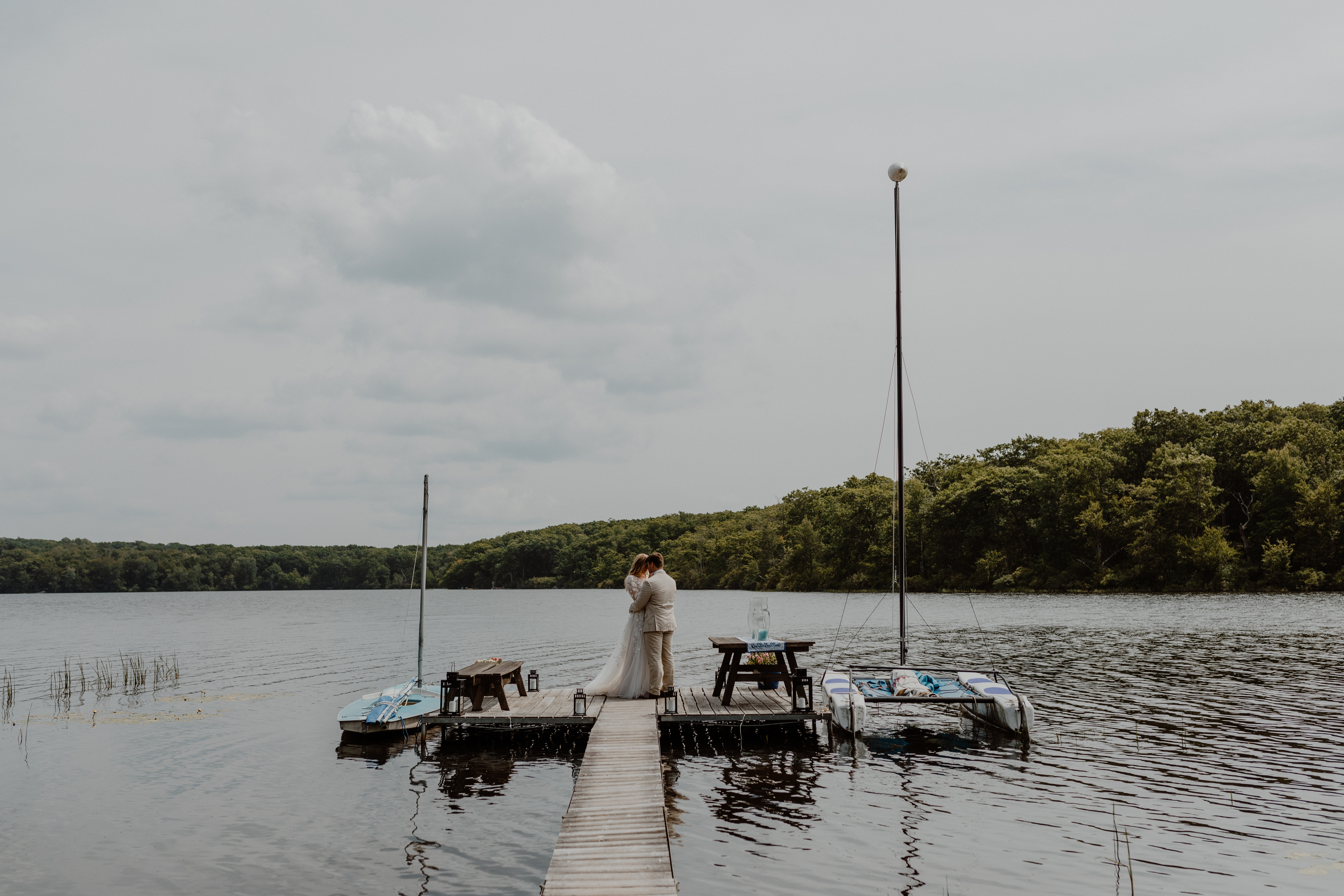 couple kissing on dock