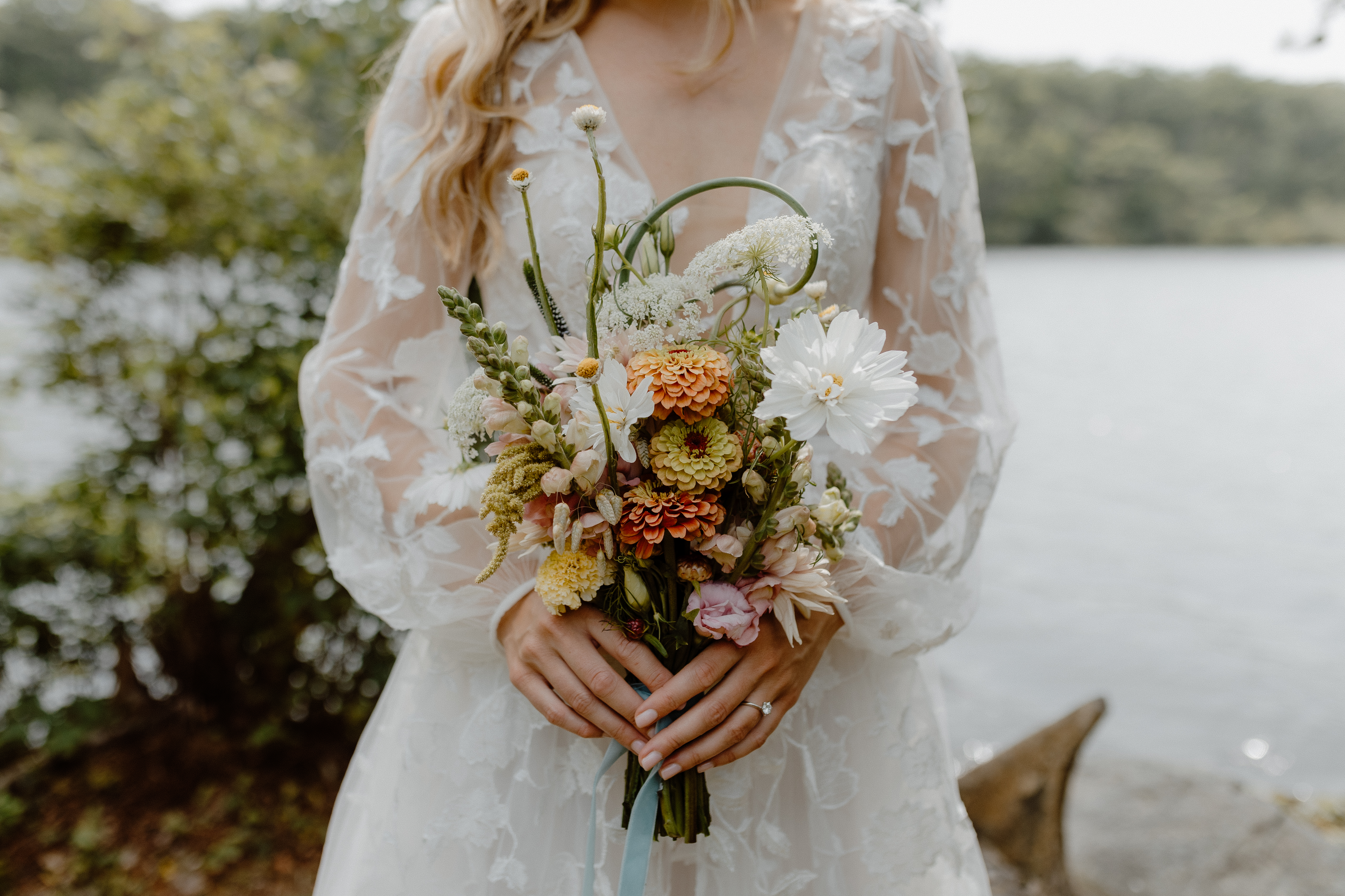 bride holding summer wildflower bouquet