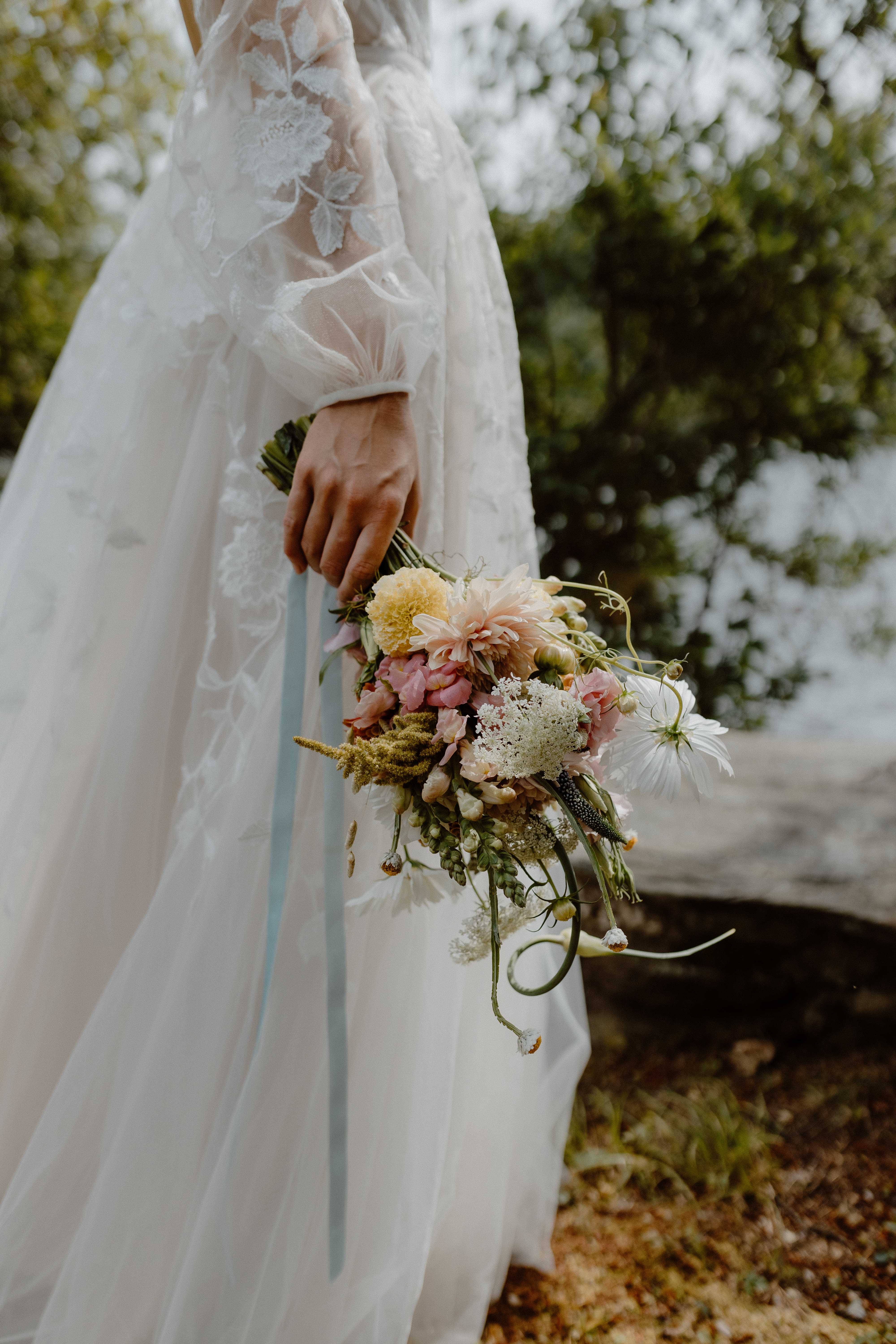 bride holding summer bridal bouquet
