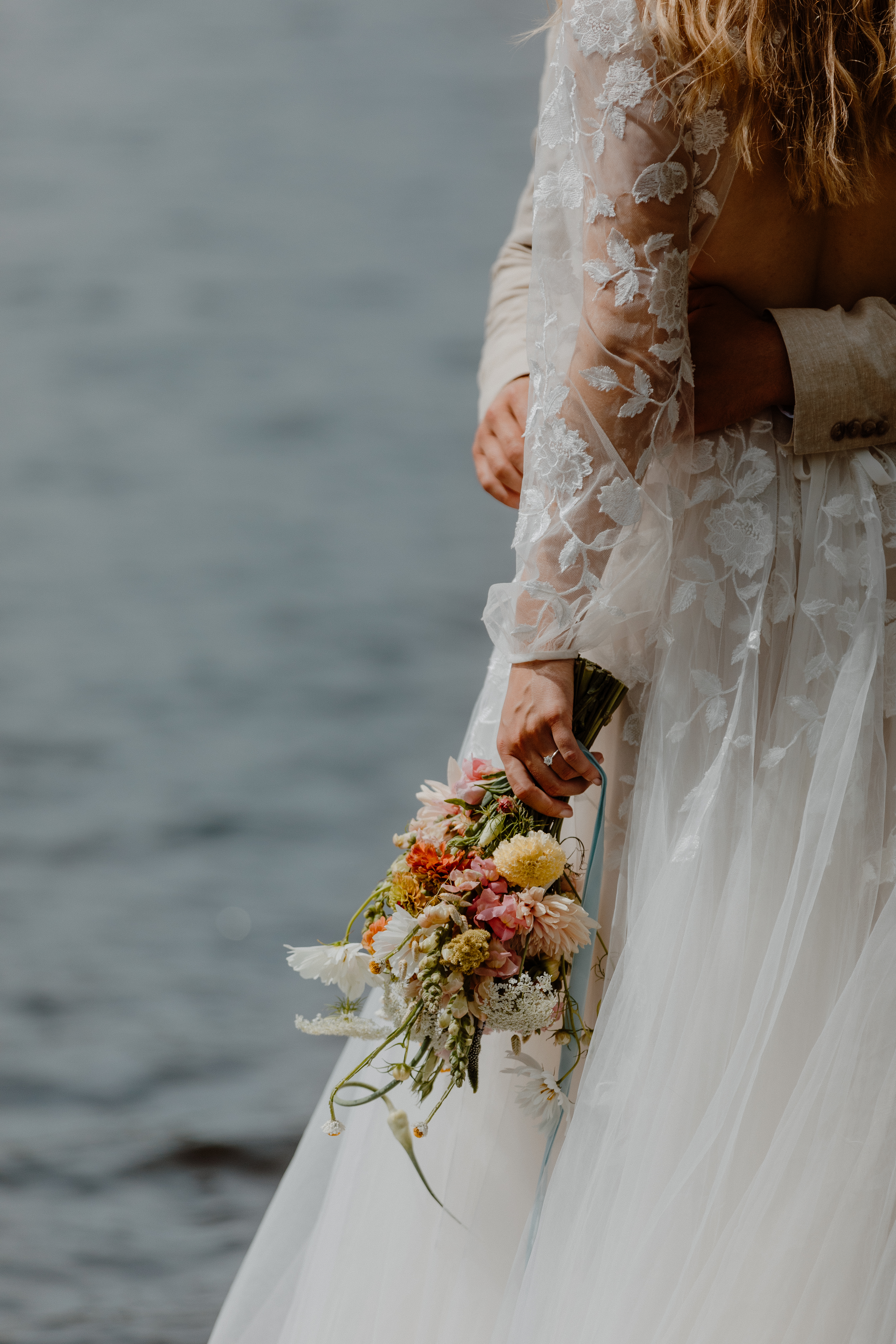 bride holding summer bridal bouquet