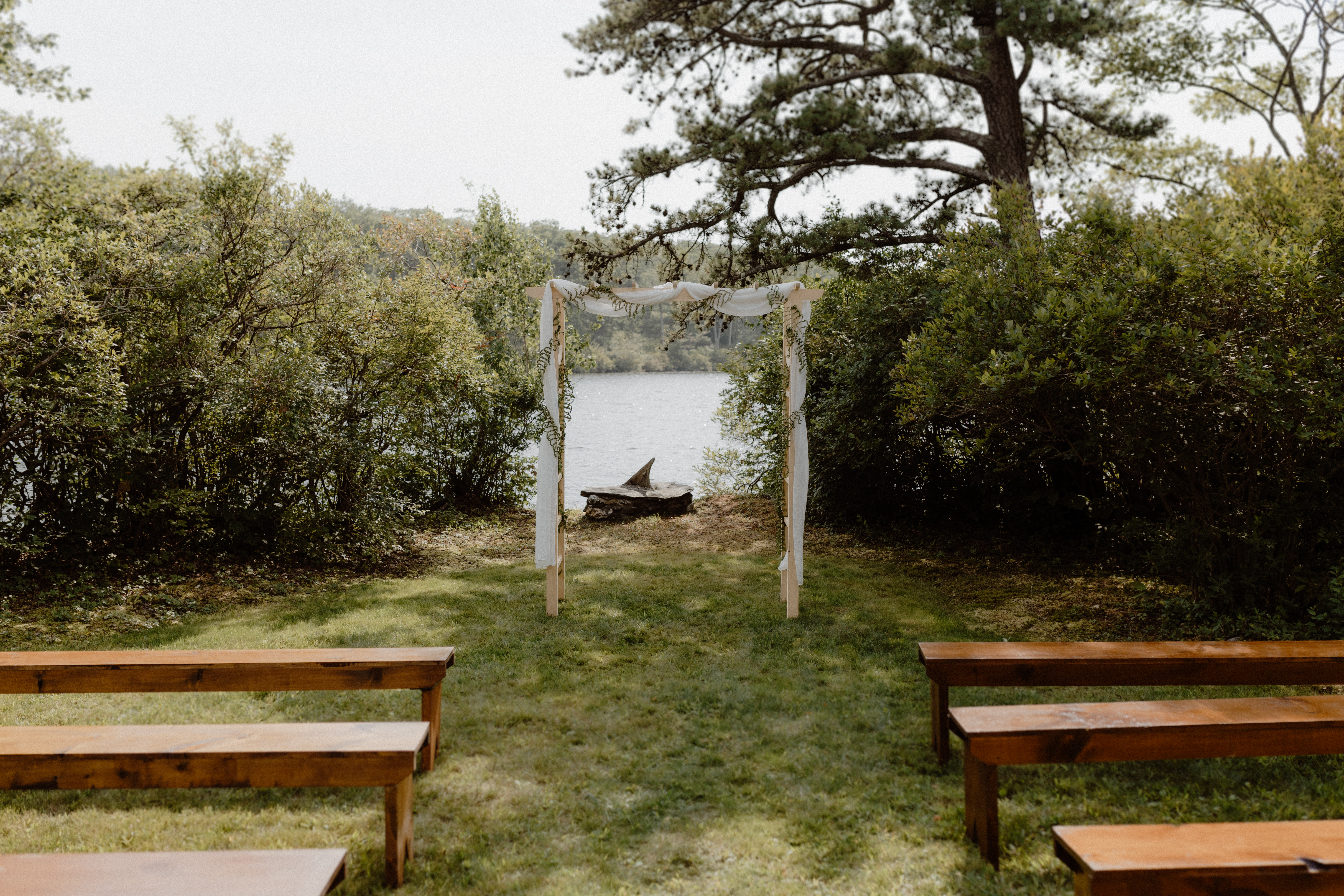 simple wedding altar in front of a lake