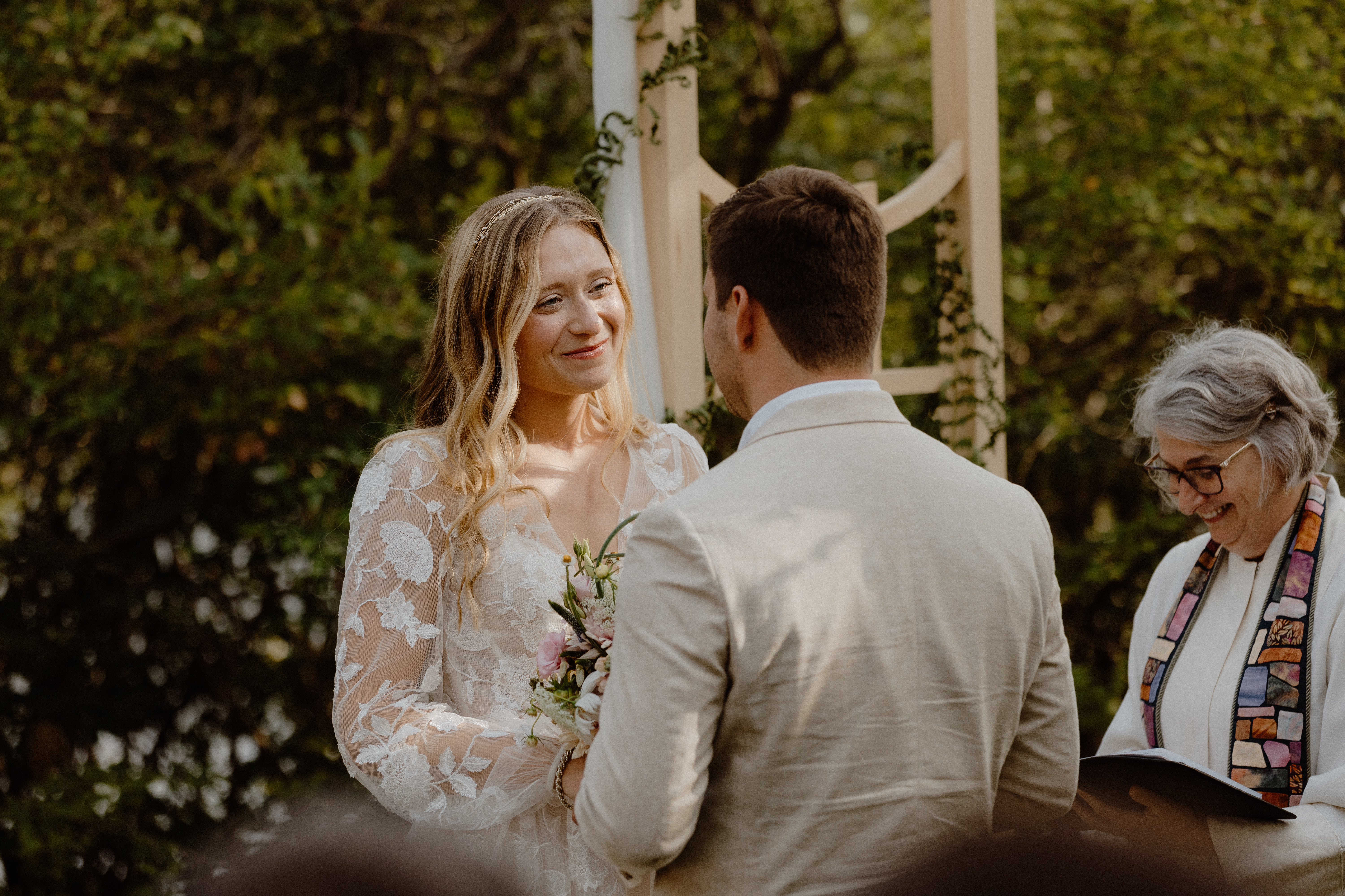 couple smiling during wedding ceremony