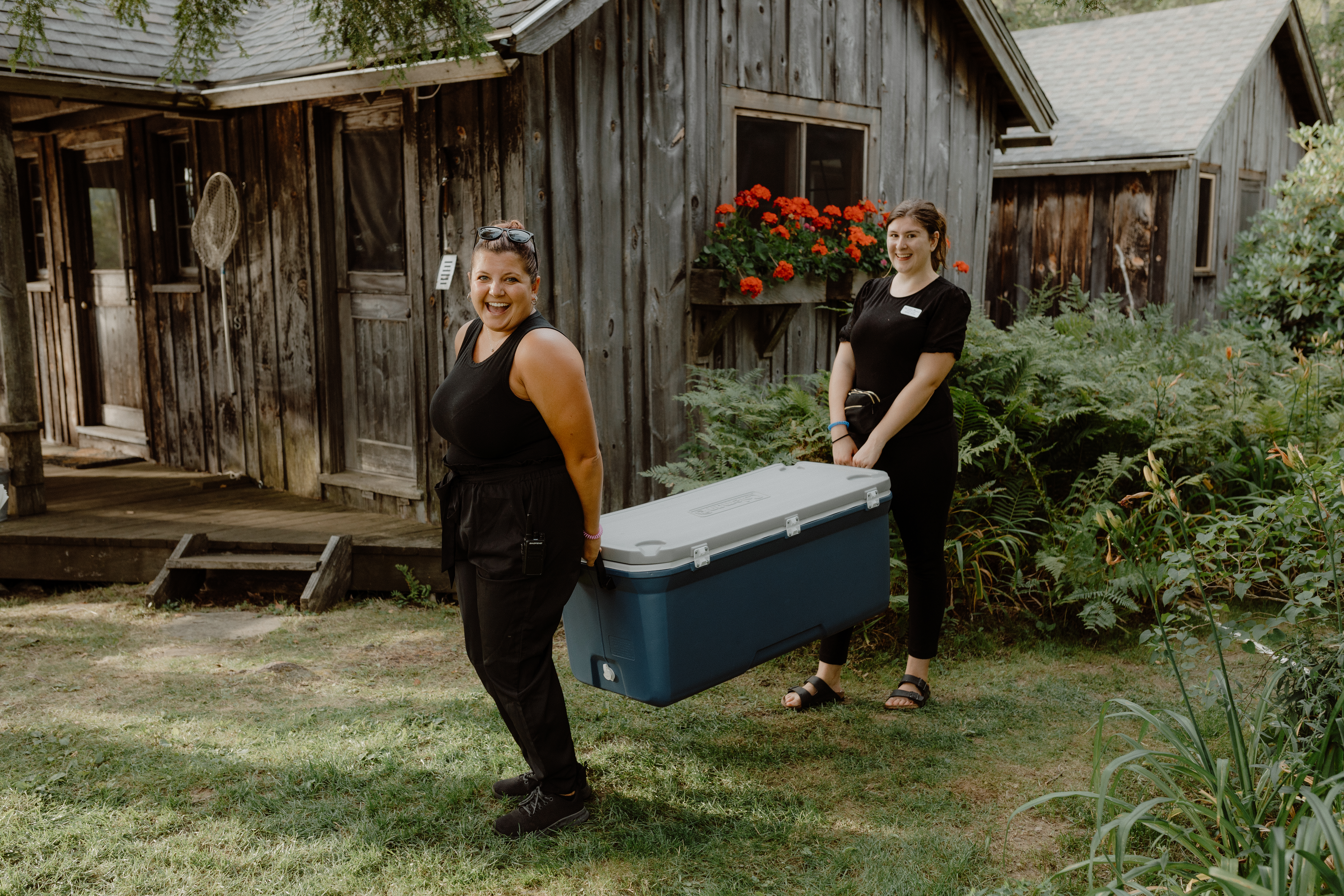 bartenders carrying cooler