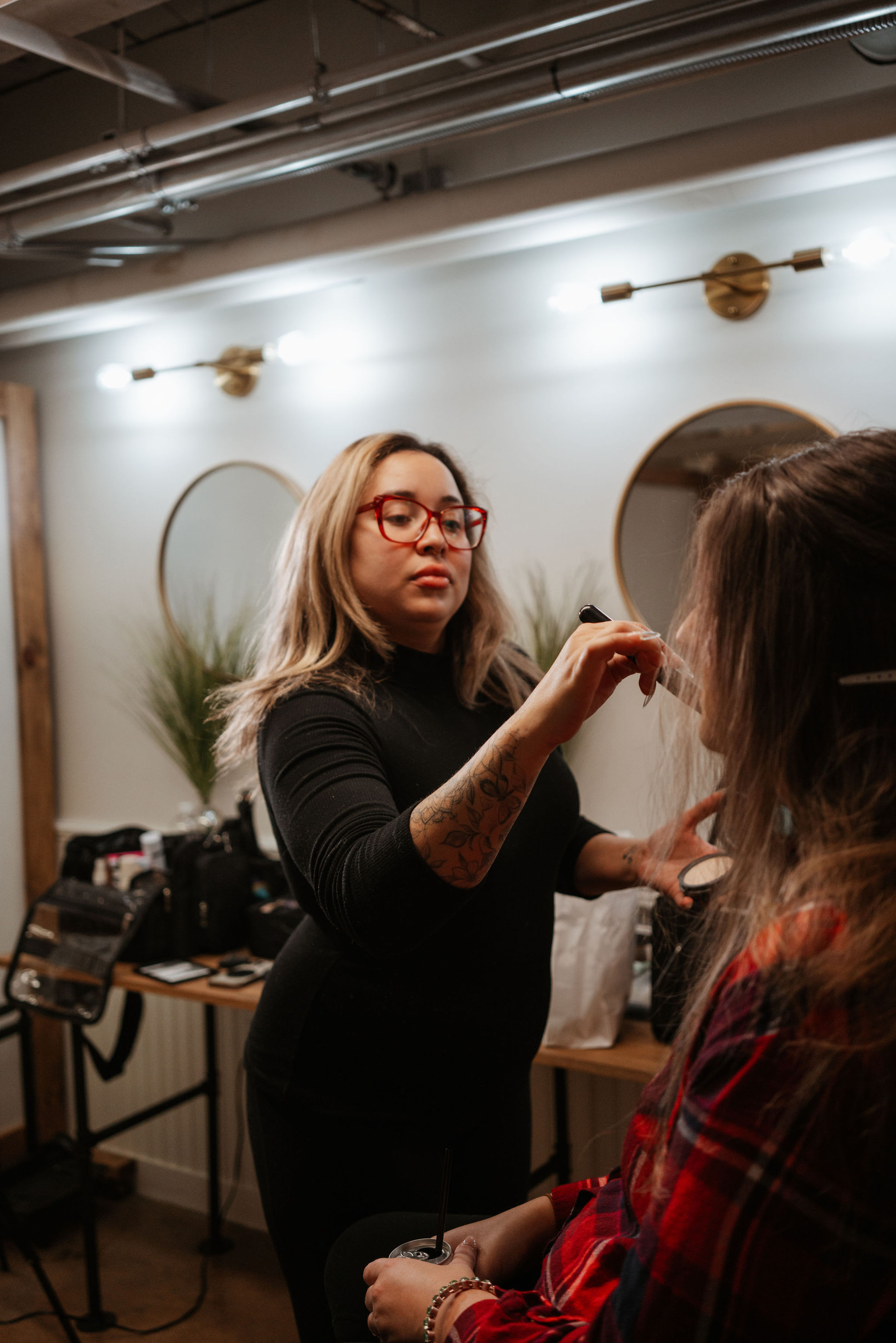 makeup artist doing bride's makeup