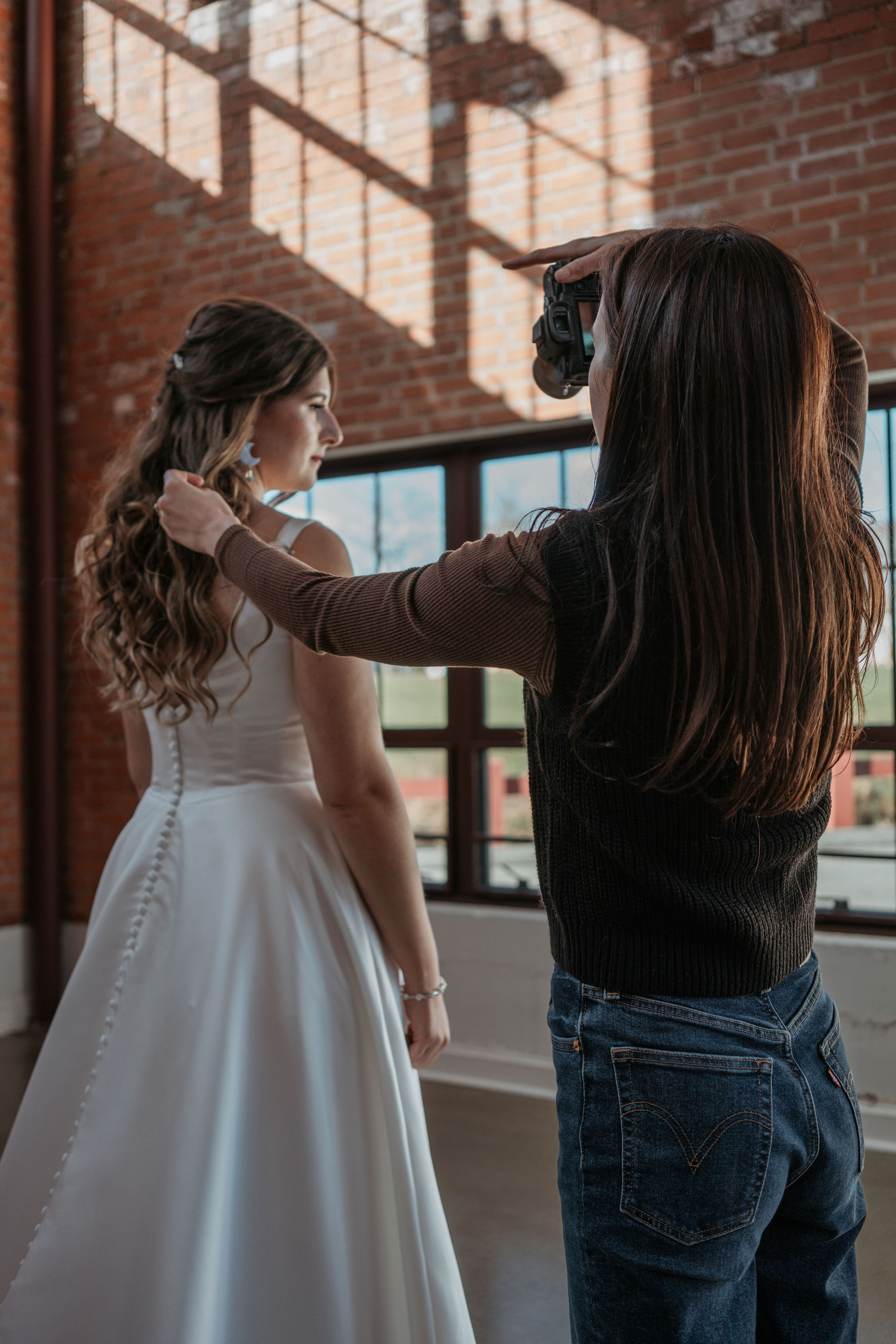 photographer taking picture of bride