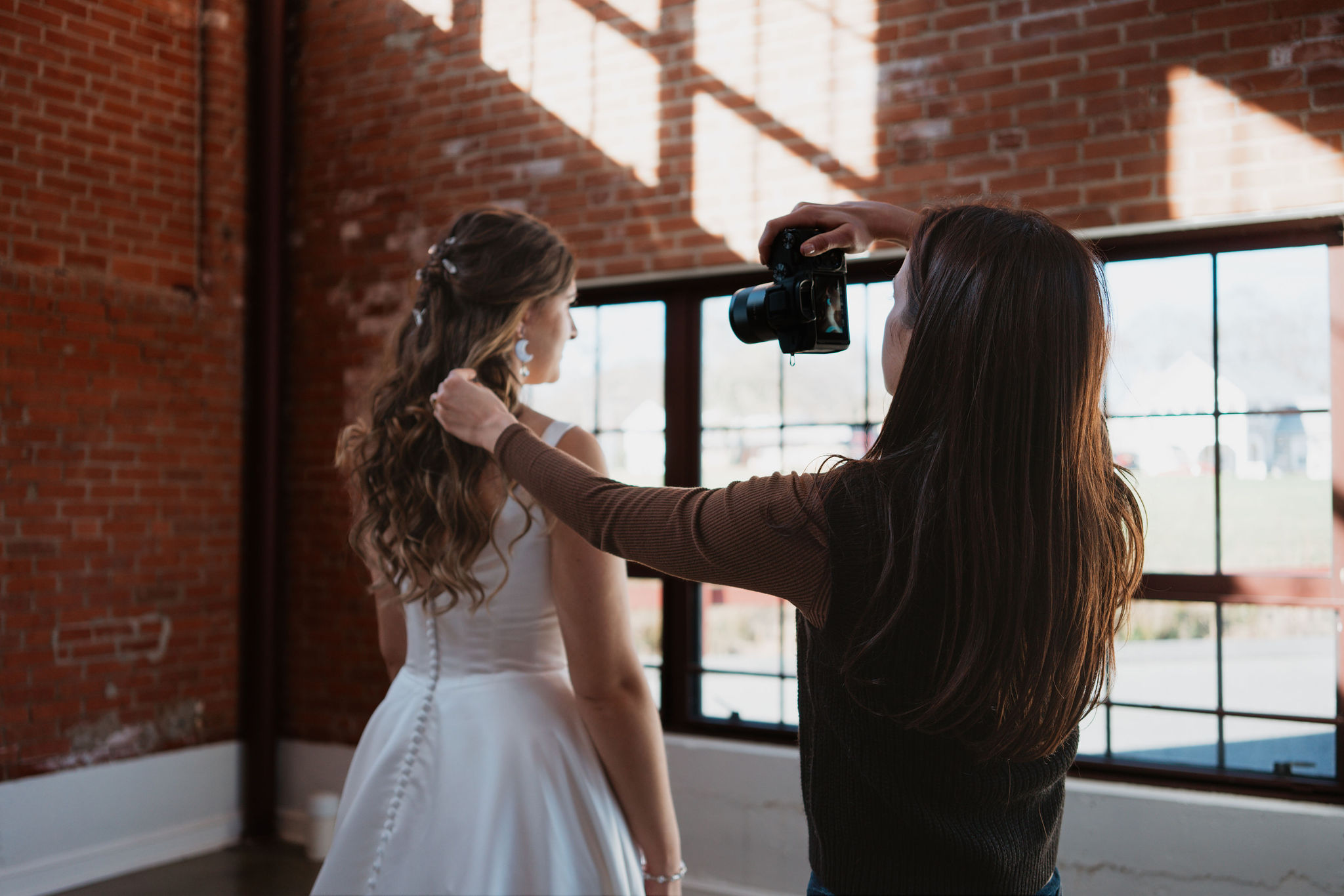 photographer taking up close picture of bride