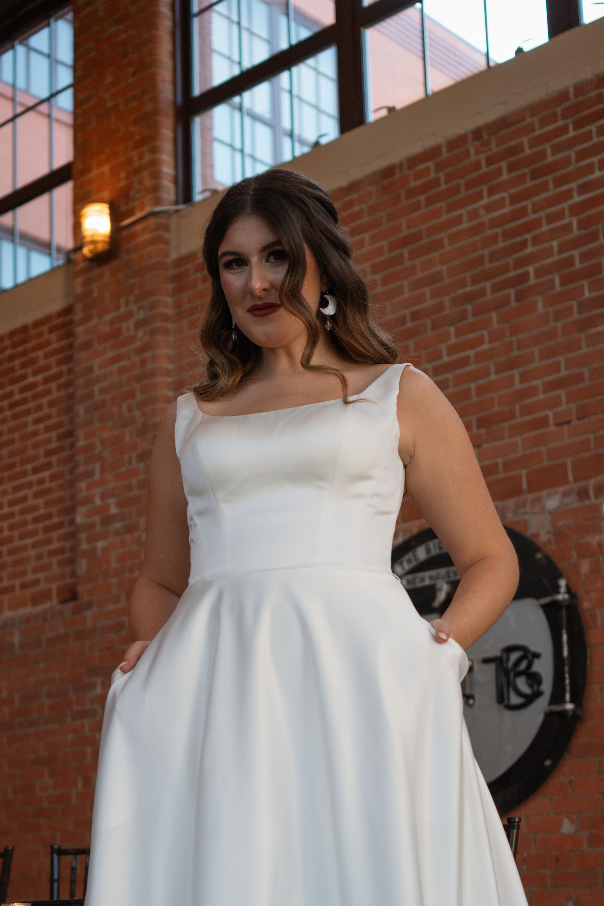 bride in elegant dress with moon earrings